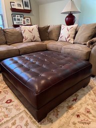 Large Tufted Leather Ottoman With Piping Detail