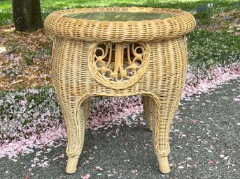 A Wicker Side Table With Glass Top By Ethan Allen