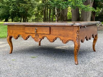 A Fine Quality French Provincial Coffee Table With Flame Mahogany Details