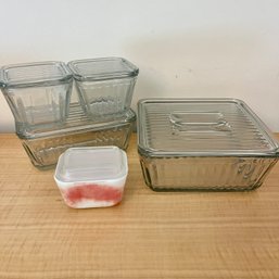 A Collection Of Glass Stackable Refrigerator Storage Boxes