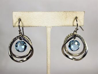 Fine Sterling Silver Circular Hoop Earrings Having Blue Topaz Stones