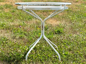 A Vintage Wrought Iron And Mesh Cocktail Table With Drink Rail