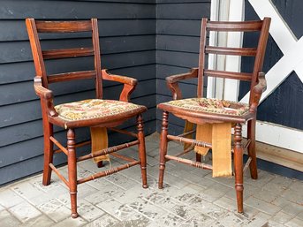 A Pair Of Antique Oak Ladder Back Arm Chairs