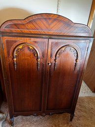 Antique 40's Era Armoire With Decorative Mixed Hardwood Inlay And Rolling Castors