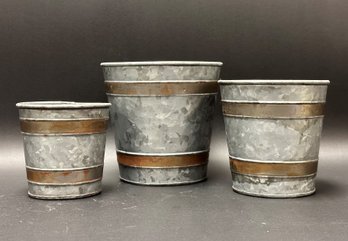 A Set Of Galvanized Metal Cachepots