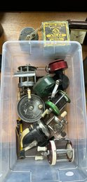 A LOT OF NINE FISHING REELS INCLUDES OCEAN CITY, BRONSON FLEETWING, BRONSON GREEN HORNET, AND A POSTAGE ATLAS