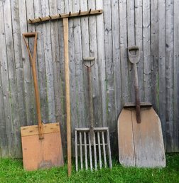A Group Of 4 Primitive Wooden Farm Tools