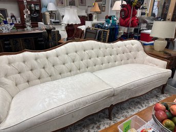 Long White Tufted Back Sofa With Wood Trim