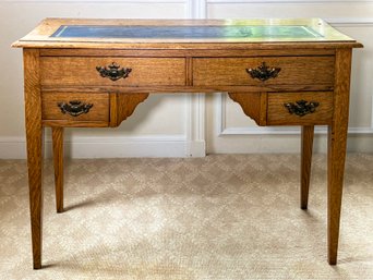 A Victorian Oak Leather Clad Writing Desk