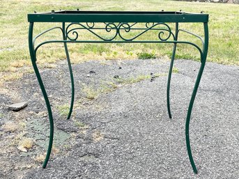 A Vintage Wrought Iron Side Table With Glass Top