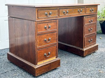 A Vintage Mahogany Knee Hole Desk With Leather Top