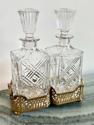 Pair Of Square Crystal Decanters In Brass Base