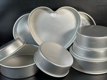 An Assortment Of Quality Cake Pans By Wilton