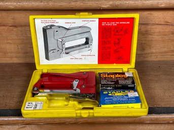 A Heavy-Duty Stapler By Swingline In Red With Case & Supplies