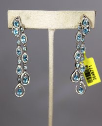 Fine Sterling Silver Pierced Earrings Having Genuine Blue Topaz