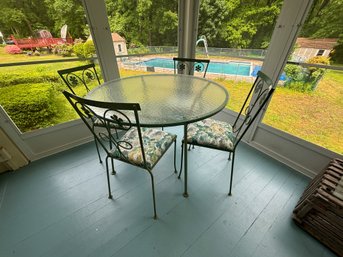 WROUGHT IRON GLASS TOP TABLE W/ FOUR CHAIRS IN THE DAISY PATTERN