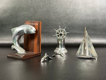 A Group Of Decorative Nautical Items: Ebony Wood & Chrome Dolphin Bookend & More