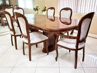 An Inlaid Marquetry And Burl Wood Extendable Pedestal Base Dining Table And Set Of 6 Chairs