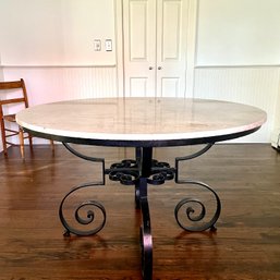 A Round Table With A Heavy Wrought Iron Base And Stone Top - 48 Inch