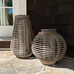 A Pair Of Rattan Crate And Barrel Hurricane Candles