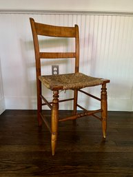 An Antique Tiger Maple Chair With Rush Seat