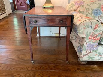 Mid 1800s Flame Mahogany Pembroke Drop Leaf Table On Casters
