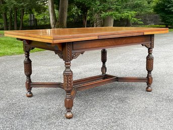 A Gorgeous Carved Mahogany Gothic Revival Extendable Dining Table