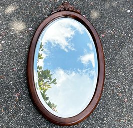 A Vintage Cherry Wood Beveled Mirror