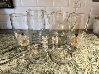 A Collection Of 2 Glass Pitchers - 2 Oil Lamps  - 2 Pillar Candle Bases & Salt & Pepper Mills