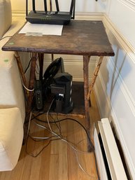 AN ANTIQUE RATTAN TABLE