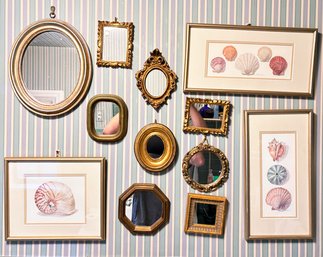 A Wall Of Small Framed Art And Mirrors