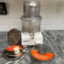 A Cuisinart Including A Compact Cover And Attachments