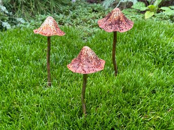 A Set Of Three Garden Mushrooms In Metal With A Naturally-Weathered Patina