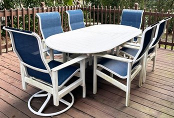 An Acrylic And Mesh Outdoor Dining Table And Chairs