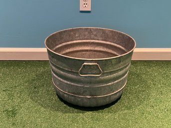 A Galvanized Metal Tub With Side Handles