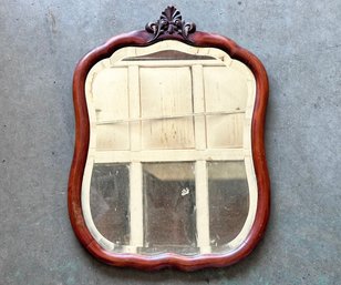 An Antique Carved Mahogany Beveled Mirror