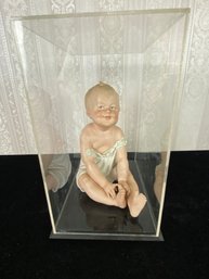 Porcelain Seated Baby Figurine