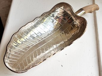 A Peruvian Sterling Silver Leaf Form Serving Dish With Mahogany Handle