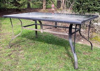 An Outdoor Glass Top Table By Hampton Bay