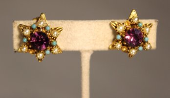 MULTI COLORED GOLD TONE STAR FORMED CLIP EARRINGS (MISSING A COUPLE SMALL STONES)