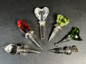 A Collection Of Decorative Bottle Stoppers