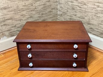 A Vintage Wooden Three Drawer Sewing Cabinet With Thread