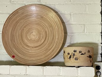 A POTTERY BOWL W/ BIRDS AND A WRAPPED WOOD CHARGER