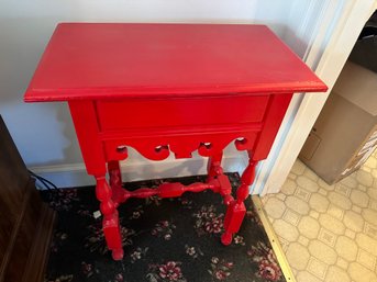 Really Cute Painted Red Table With Scroll Work On Sides