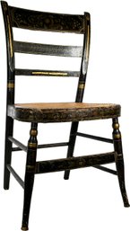 An Antique Hitchcock Chair With Cane Seat