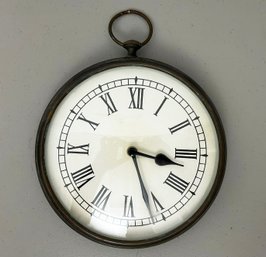 A Large Wall Clock In Stopwatch Form