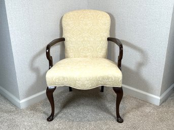 A Vintage Arm Chair Upholstered In A Buttery Yellow Damask Fabric