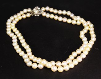 SUPERB DOUBLE STRAND OF GENUINE PEARLS HAVING LARGE 14K WHITE GOLD DIAMOND CLASP