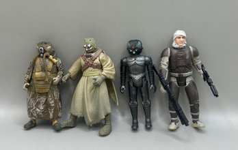 4 Star Wars Figures: 1997 Zuckuss Bounty Hunter, 1996 Tusken Raider, 1982 Zuckuss, & 1997 Dengar