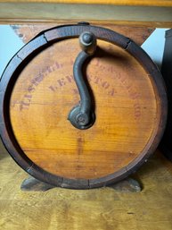 AN ANTIQUE STENCILED TABLE TOP BUTTER CHURN, LEWISTON ME